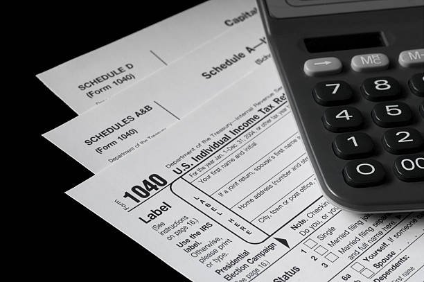 A calculator placed on a tax document, symbolizing financial calculations and assessment of online credit report errors